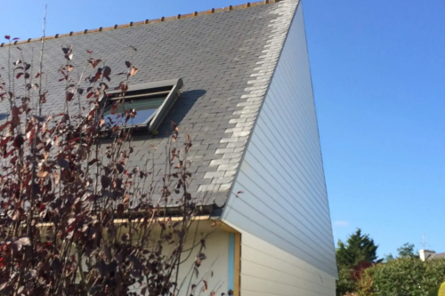 Pose d'un bardage bois extérieur avec isolant sur habitation