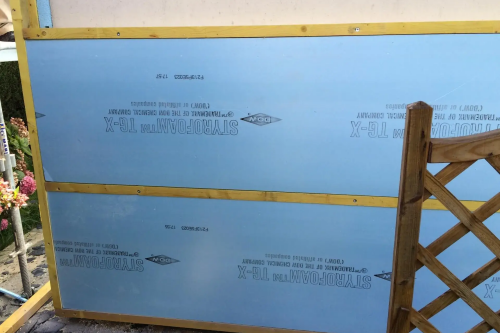 Pose d'un bardage bois extérieur avec isolant sur habitation