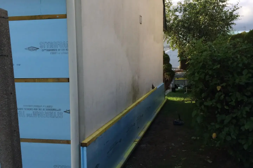 Pose d'un bardage bois extérieur avec isolant sur habitation