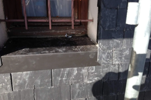 Pose d'un bardage en ardoises naturelles sur pignons